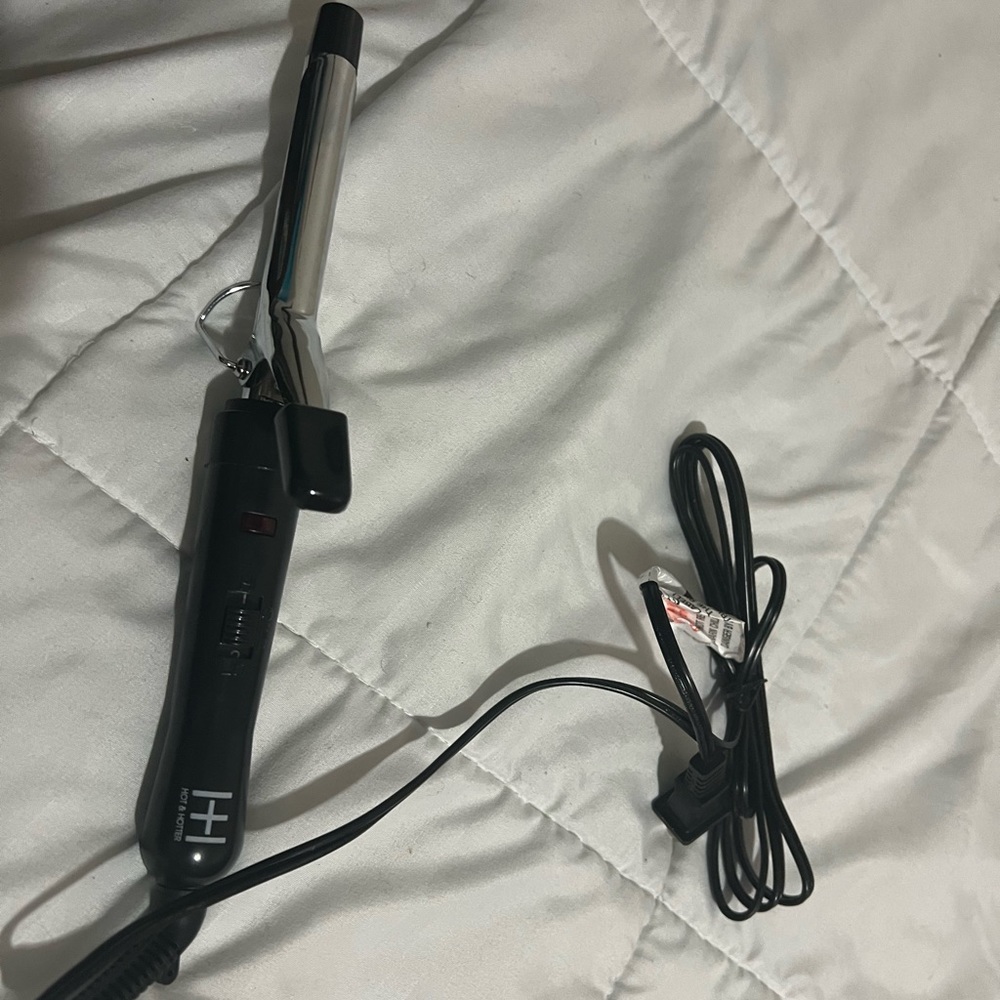 Medium size curling iron never been use
